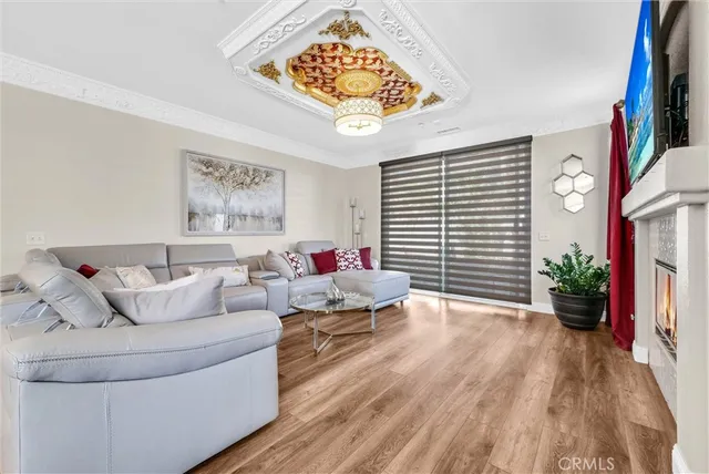 a kitchen with cabinets and wooden floor