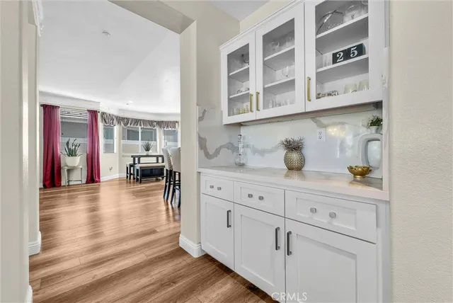 a kitchen with stainless steel appliances granite countertop a white cabinets and sink