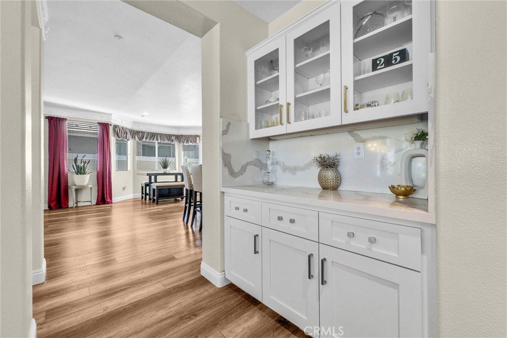 11499 Bridgeway Drive Riverside, CA 92505 - Photo 19 of 65 a kitchen with cabinets and wooden floor