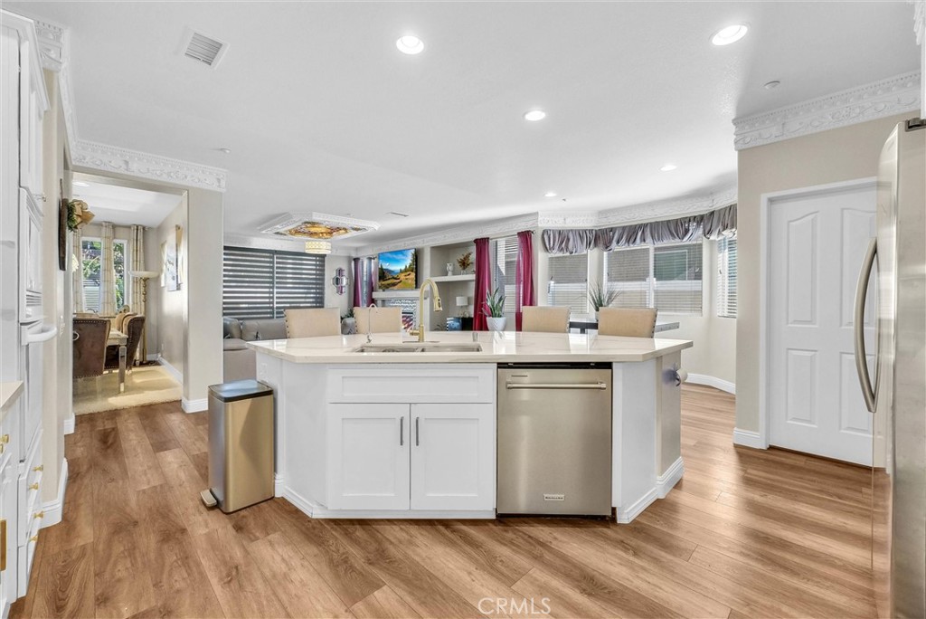 11499 Bridgeway Drive Riverside, CA 92505 - Photo 25 of 65 a kitchen with stainless steel appliances granite countertop a white cabinets and sink