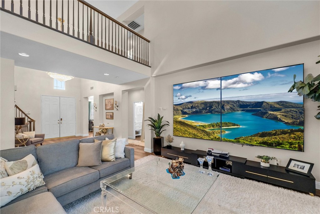 11499 Bridgeway Drive Riverside, CA 92505 - Photo 3 of 65 a living room with furniture flat screen tv and windows