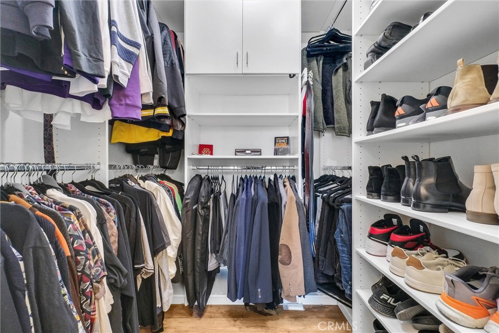 11499 Bridgeway Drive Riverside, CA 92505 - Photo 33 of 65 a view of walk in closet with clothes and shoes