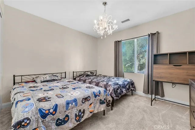 a view of a patio with table and chairs and potted plants