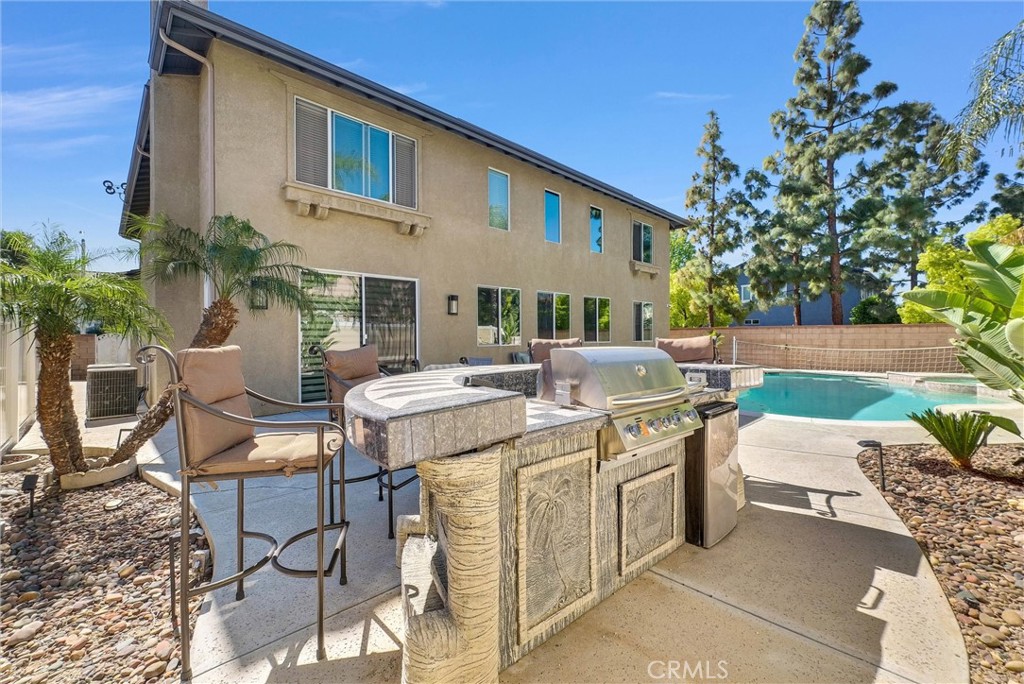 11499 Bridgeway Drive Riverside, CA 92505 - Photo 47 of 65 a view of a patio with table and chairs and potted plants