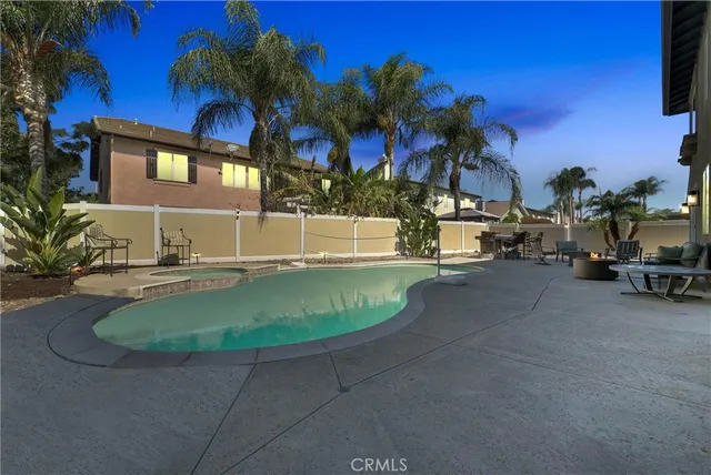 a view of an empty room with stairs and a window