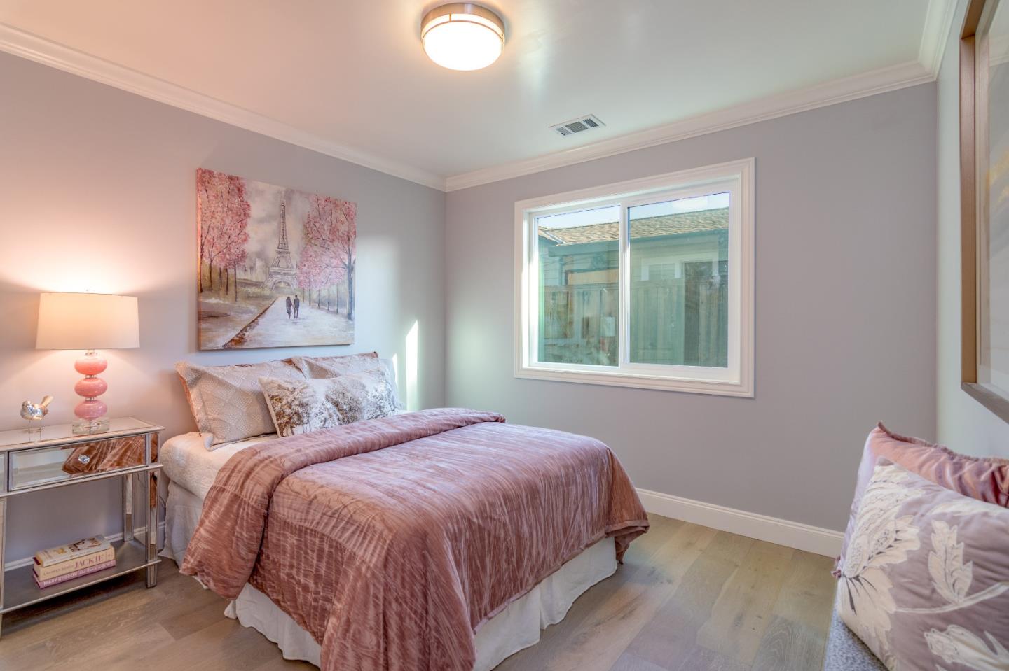 654 Malarin Avenue Santa Clara, CA 95050 - Photo 16 of 31 a bedroom with a bed and a window