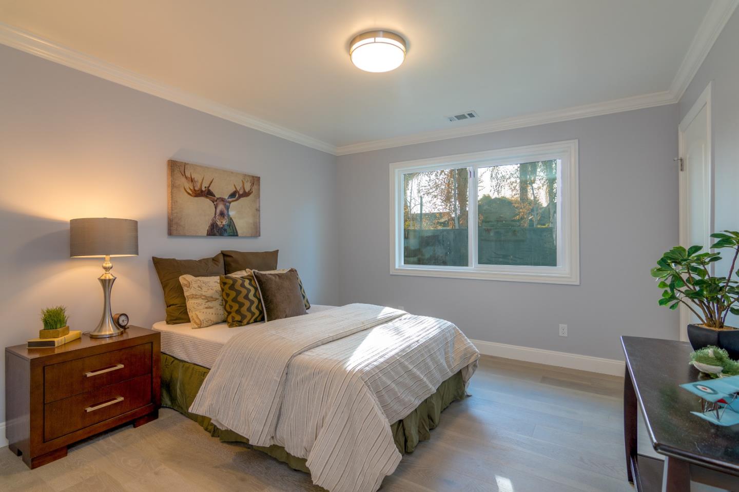 654 Malarin Avenue Santa Clara, CA 95050 - Photo 17 of 31 a bed room with a bed and a window