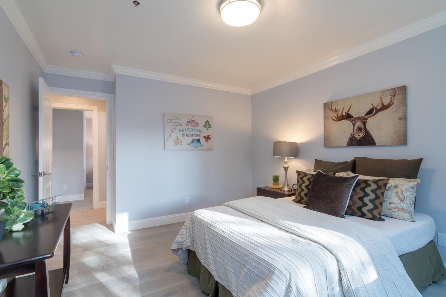 654 Malarin Avenue Santa Clara, CA 95050 - Photo 18 of 31 a bedroom with a bed and a painting on the wall