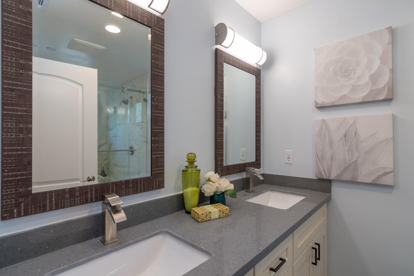 654 Malarin Avenue Santa Clara, CA 95050 - Photo 21 of 31 a bathroom with a granite countertop sink and a mirror