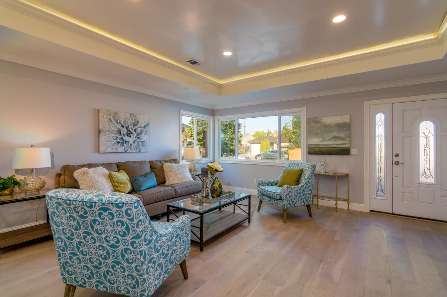654 Malarin Avenue Santa Clara, CA 95050 - Photo 8 of 31 a living room with furniture and a large window
