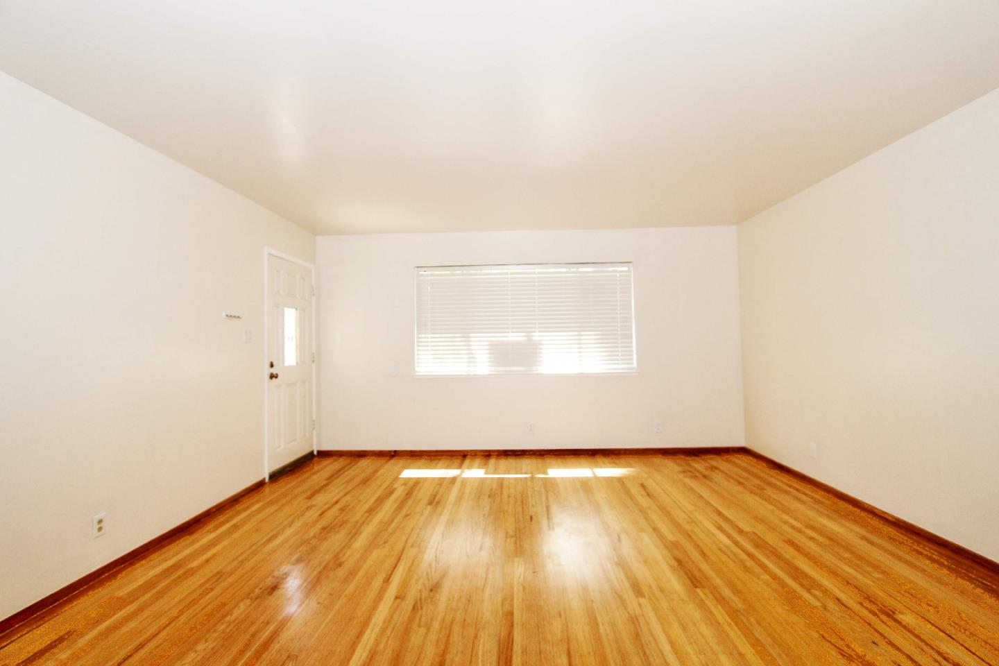 3310 Invicta Way San Jose, CA 95118 - Photo 3 of 23 a view of a room with wooden floor and white walls