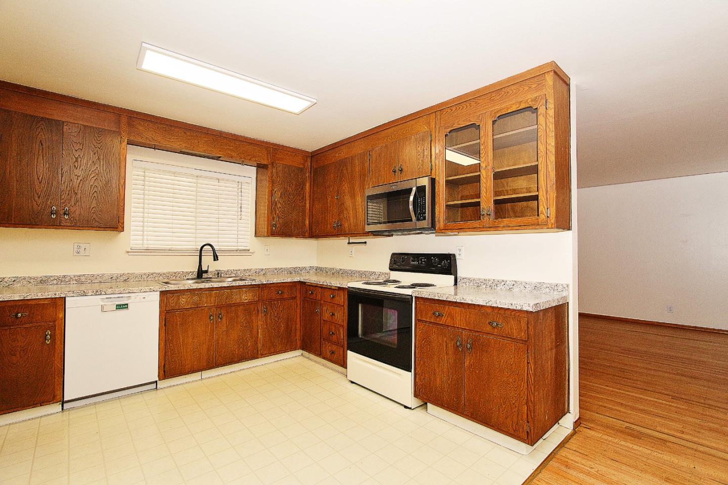 3310 Invicta Way San Jose, CA 95118 - Photo 6 of 23 a kitchen with stainless steel appliances granite countertop a sink stove and wooden cabinets