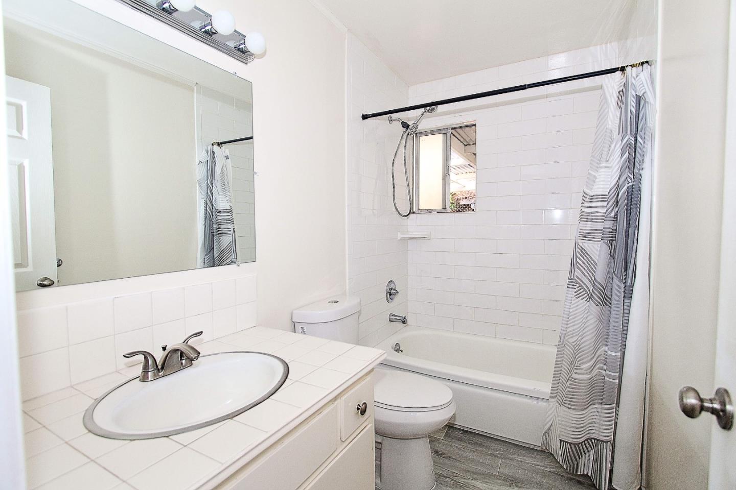 3310 Invicta Way San Jose, CA 95118 - Photo 10 of 23 a bathroom with a sink toilet and shower