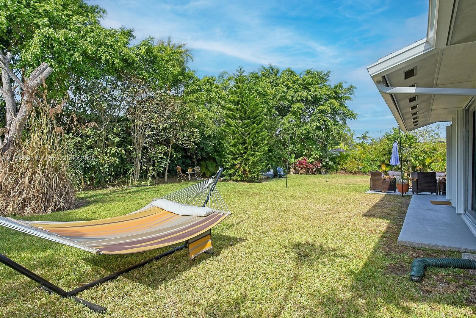 10900 Southwest 124th Road Miami, FL 33176 - Photo 20 of 22 a view of a backyard with swimming pool