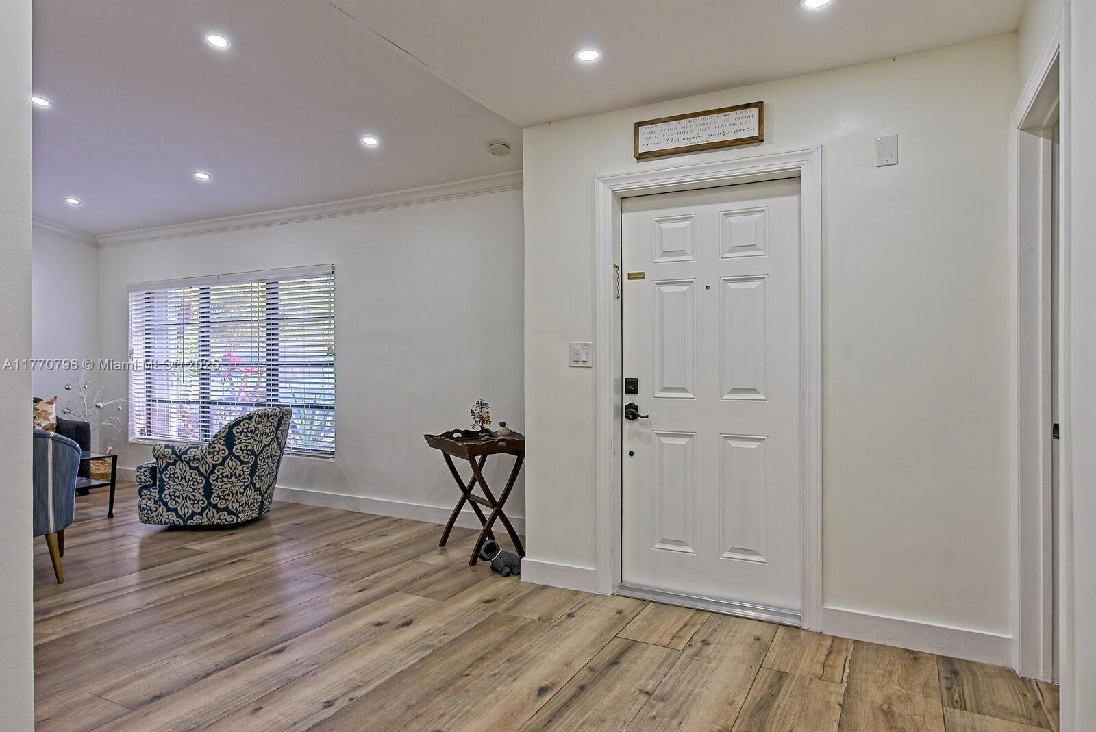 10900 Southwest 124th Road Miami, FL 33176 - Photo 2 of 22 a view of room with wooden floor and windows