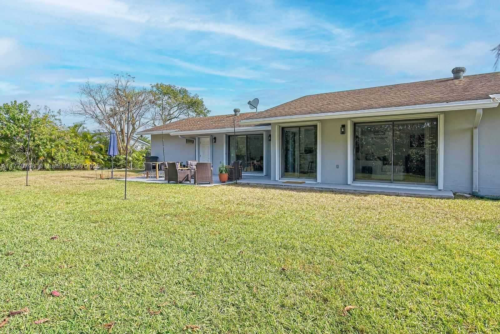 10900 Southwest 124th Road Miami, FL 33176 - Photo 21 of 22 a view of a house with a swimming pool