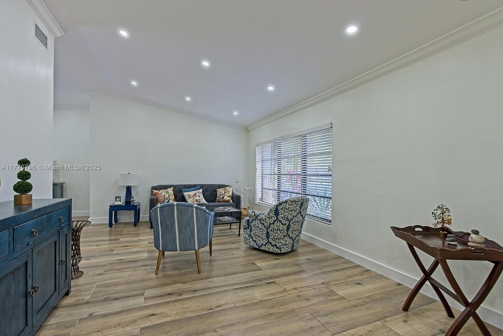 10900 Southwest 124th Road Miami, FL 33176 - Photo 3 of 22 a view of a dining room with furniture and wooden floor