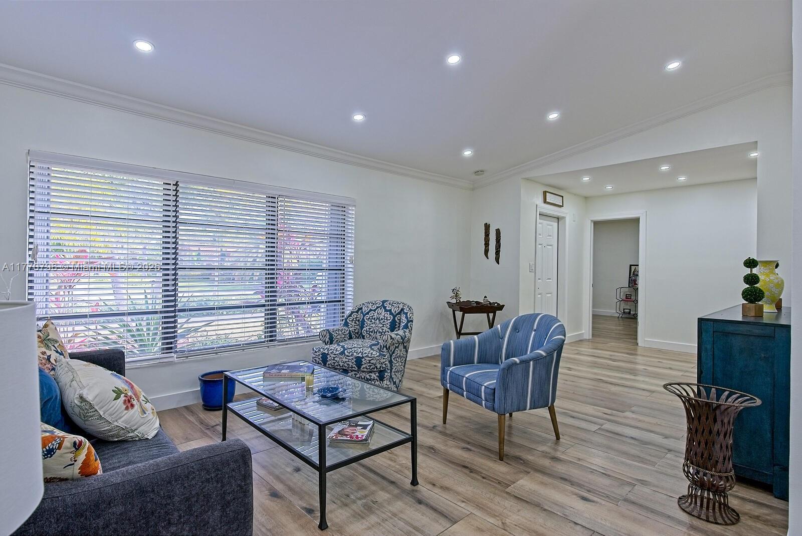 10900 Southwest 124th Road Miami, FL 33176 - Photo 4 of 22 a living room with furniture and a window