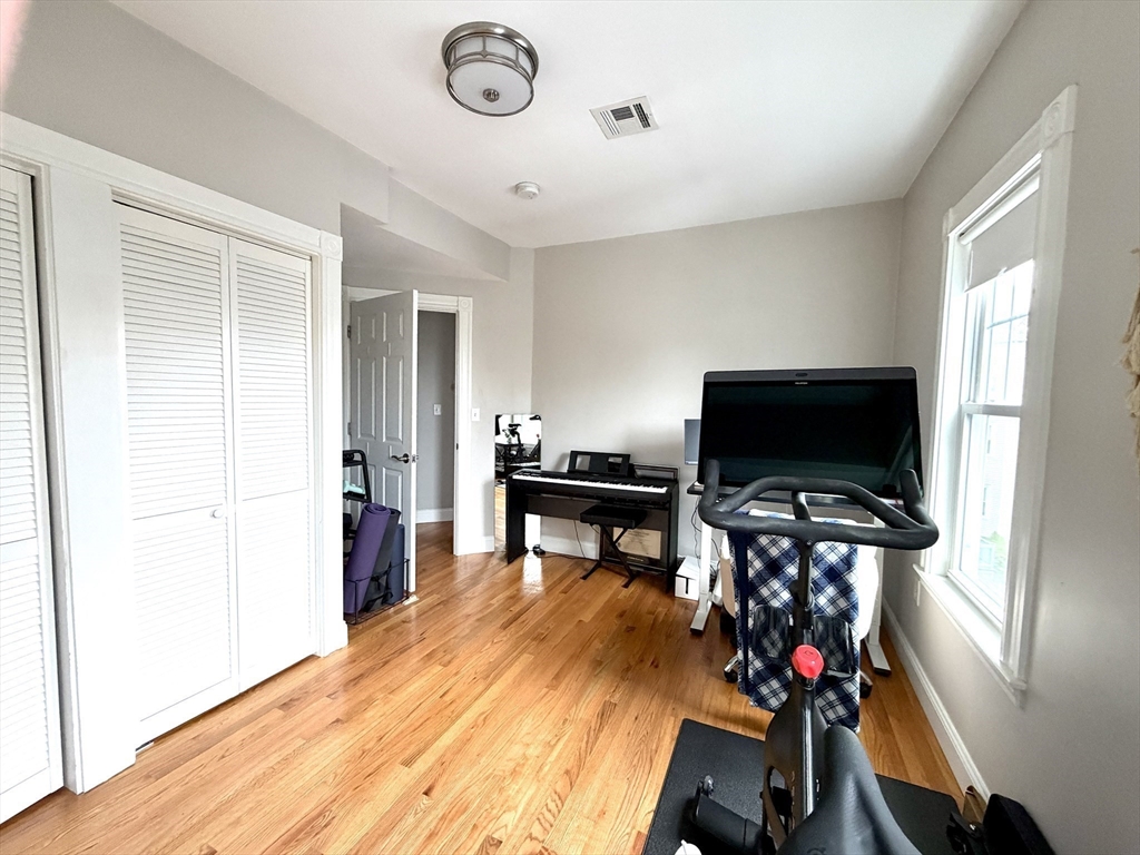 37 Moseley Street, Unit 3 Boston, MA 02125 - Photo 11 of 17 a living room with furniture and a flat screen tv