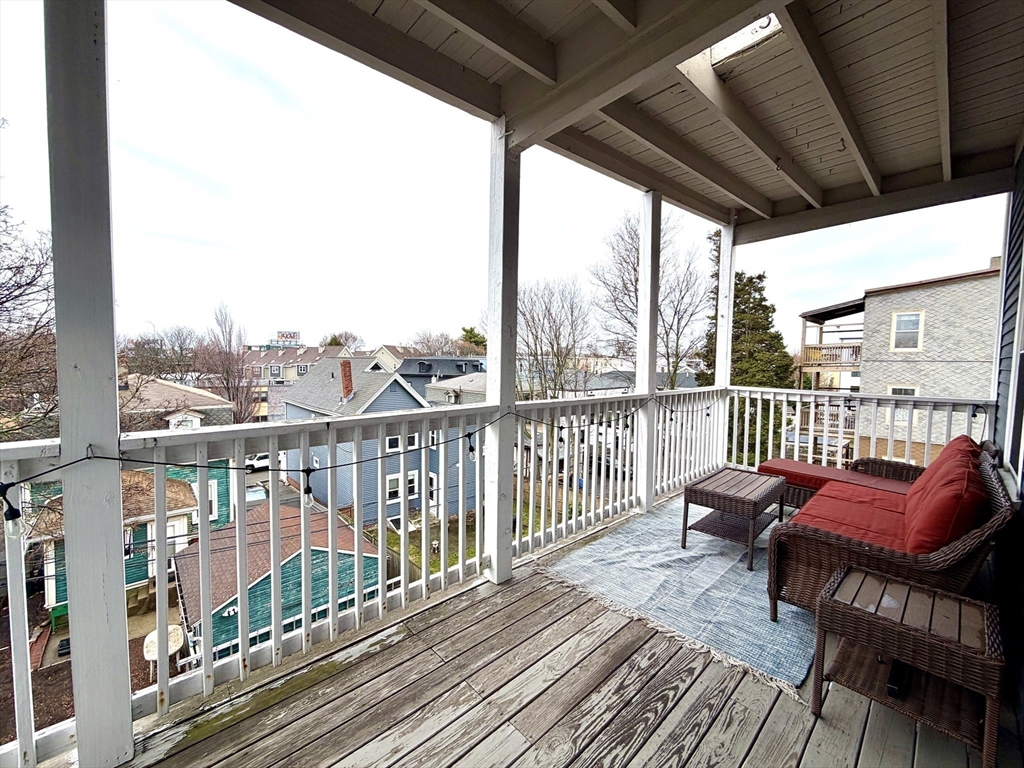37 Moseley Street, Unit 3 Boston, MA 02125 - Photo 14 of 17 a view of a balcony with wooden floor