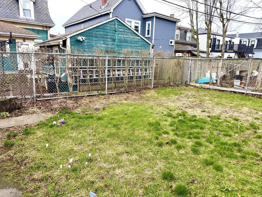 37 Moseley Street, Unit 3 Boston, MA 02125 - Photo 16 of 17 a view of a house with a yard