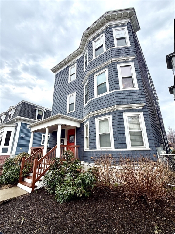 37 Moseley Street, Unit 3 Boston, MA 02125 - Photo 17 of 17 a front view of a residential apartment building with a yard