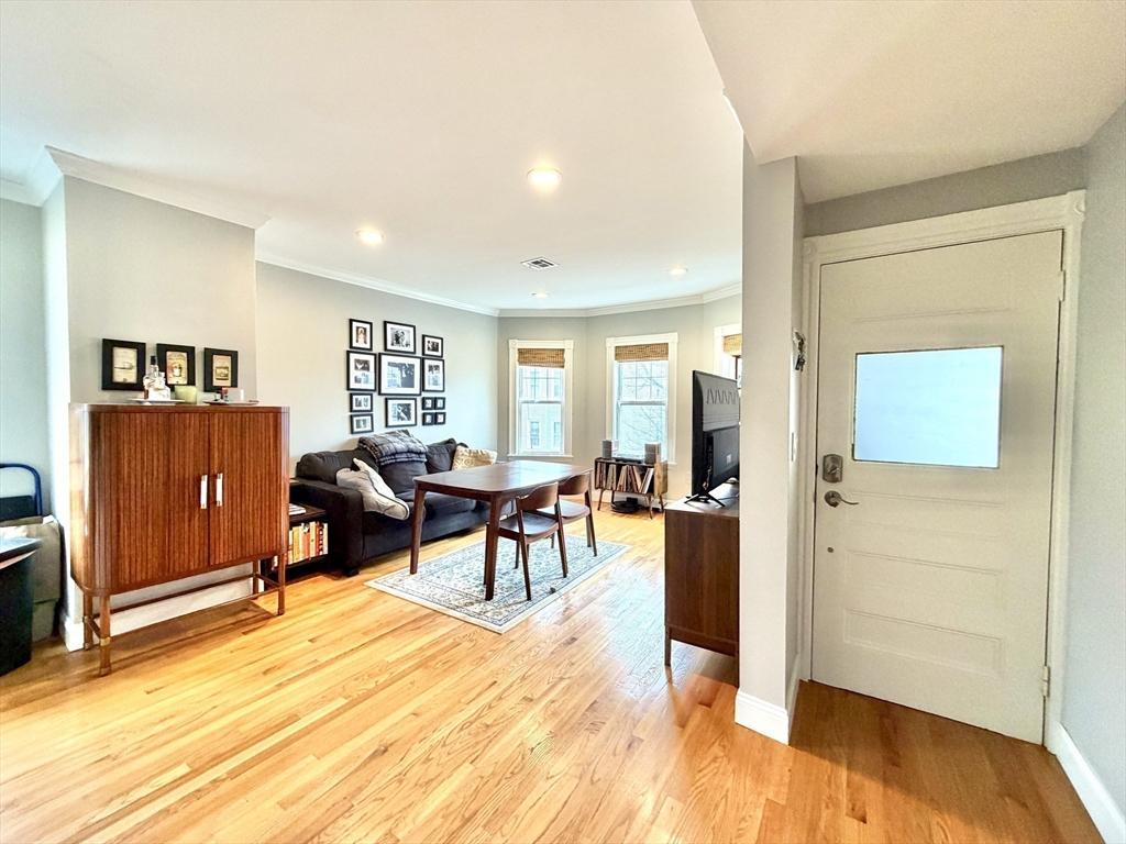 37 Moseley Street, Unit 3 Boston, MA 02125 - Photo 5 of 17 a living room with furniture and a wooden floor