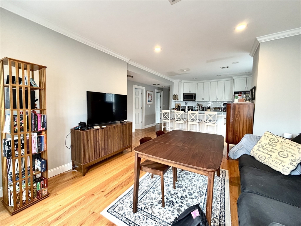 37 Moseley Street, Unit 3 Boston, MA 02125 - Photo 6 of 17 a living room with furniture and a flat screen tv