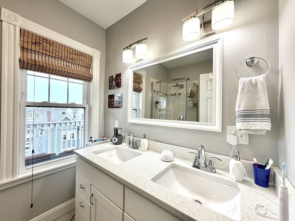 37 Moseley Street, Unit 3 Boston, MA 02125 - Photo 8 of 17 a bathroom with a sink double vanity and a window