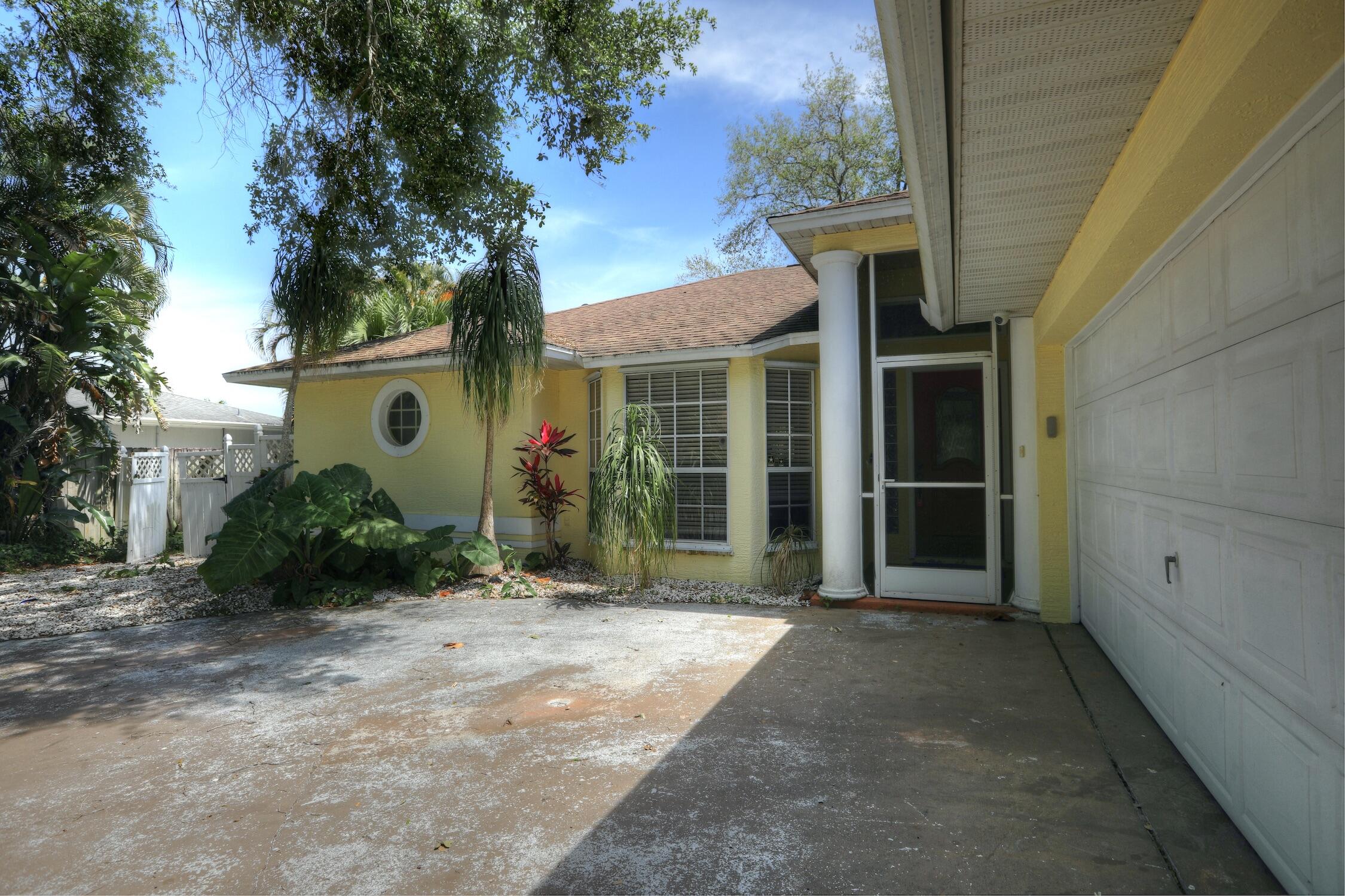 1245 George Street Sebastian, FL 32958 - Photo 11 of 36 a front view of a house with a yard