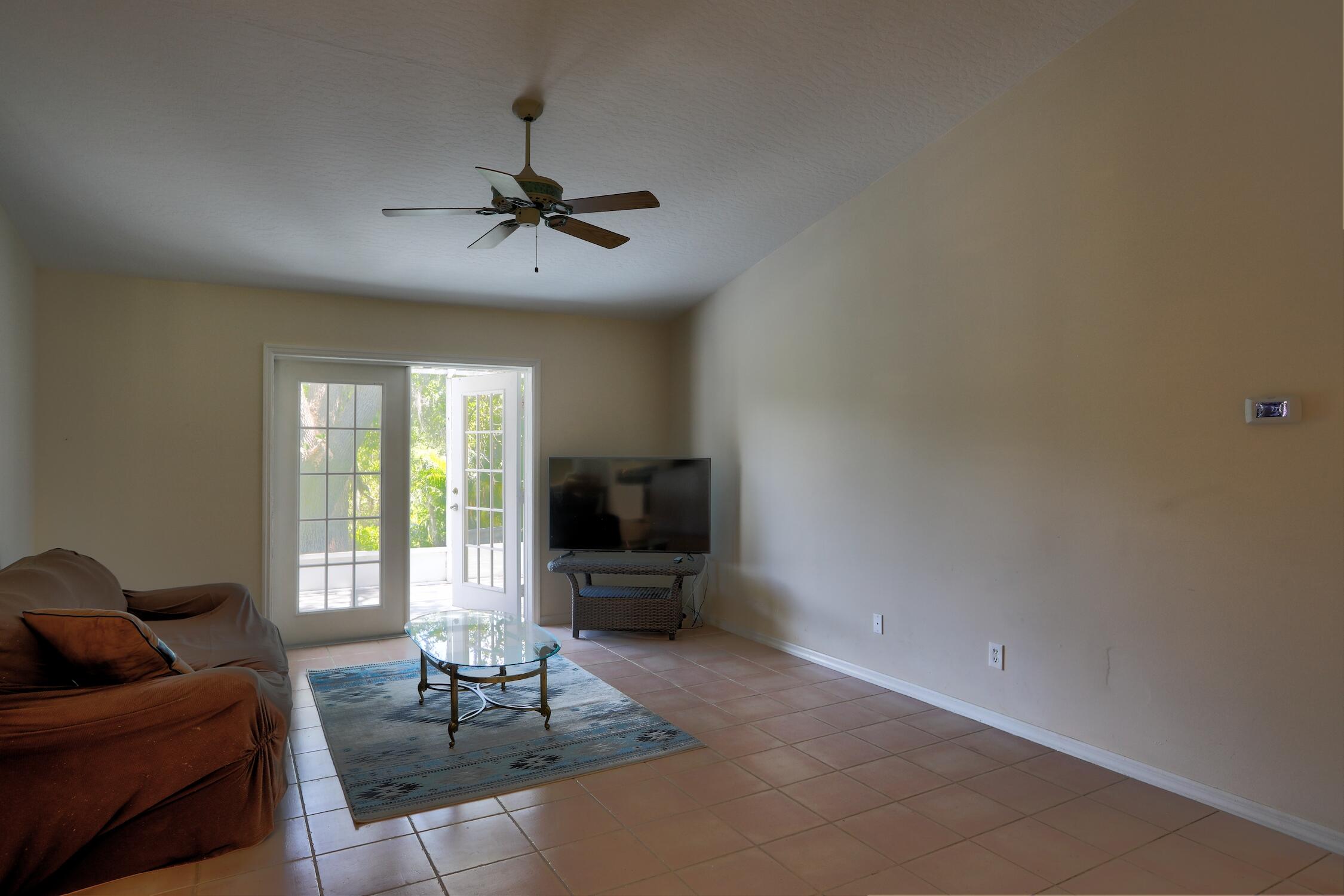 1245 George Street Sebastian, FL 32958 - Photo 15 of 36 a living room with furniture and a flat screen tv