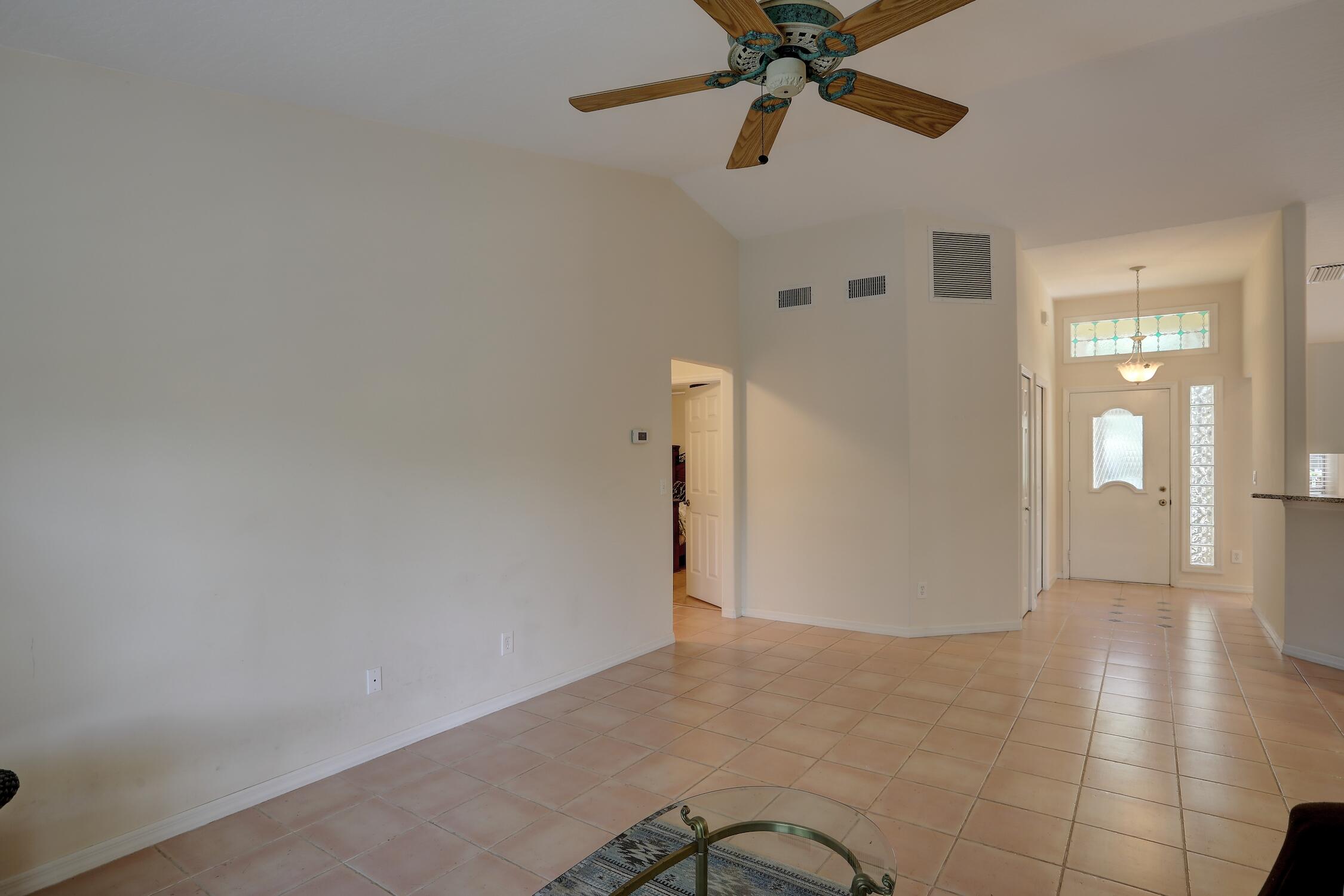 1245 George Street Sebastian, FL 32958 - Photo 17 of 36 a view of a livingroom with a ceiling fan and window