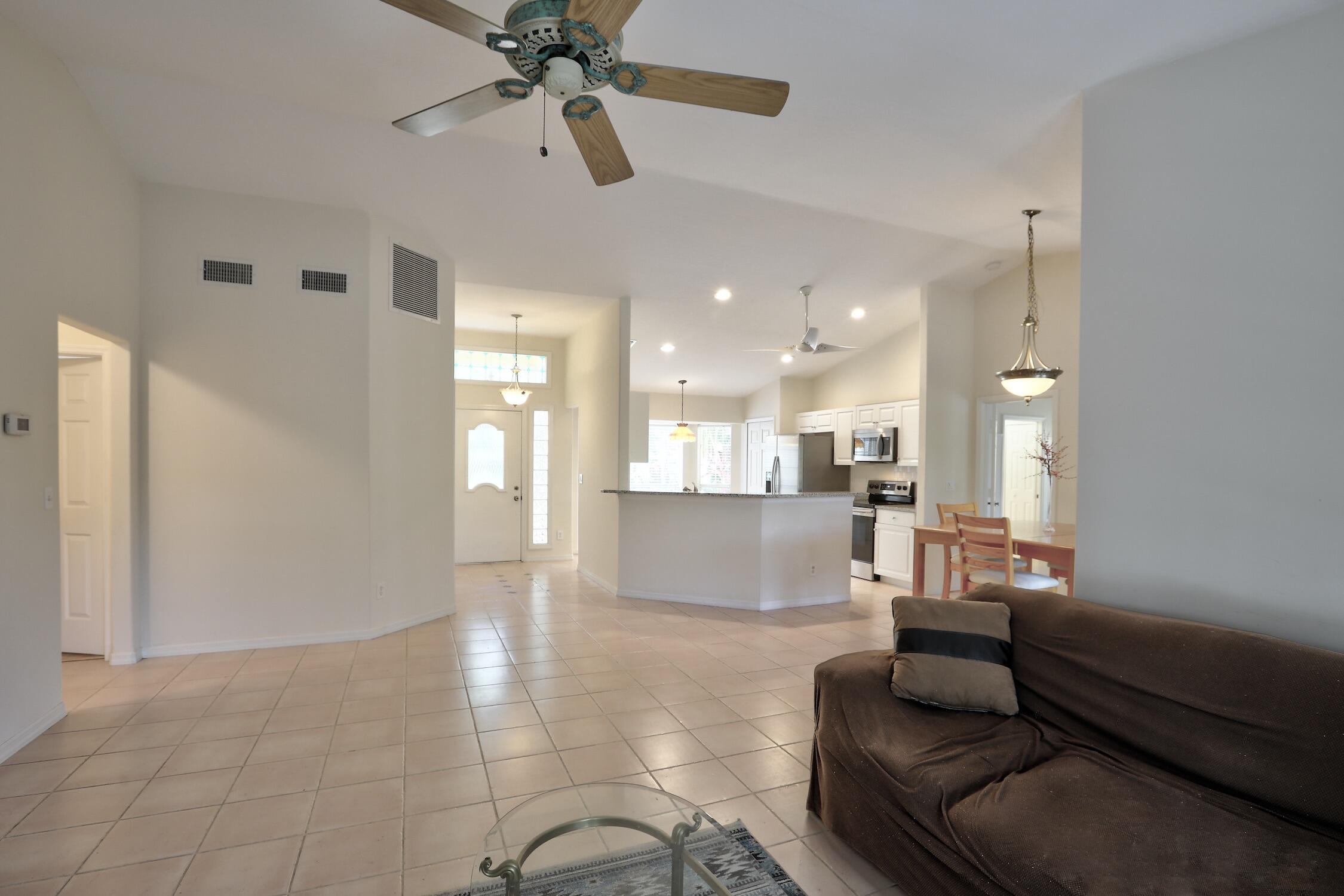 1245 George Street Sebastian, FL 32958 - Photo 18 of 36 a living room with furniture and a chandelier