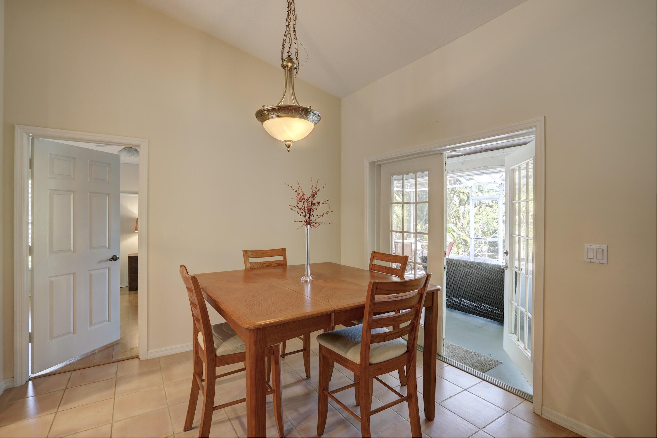 1245 George Street Sebastian, FL 32958 - Photo 20 of 36 a view of a dining room with furniture and chandelier
