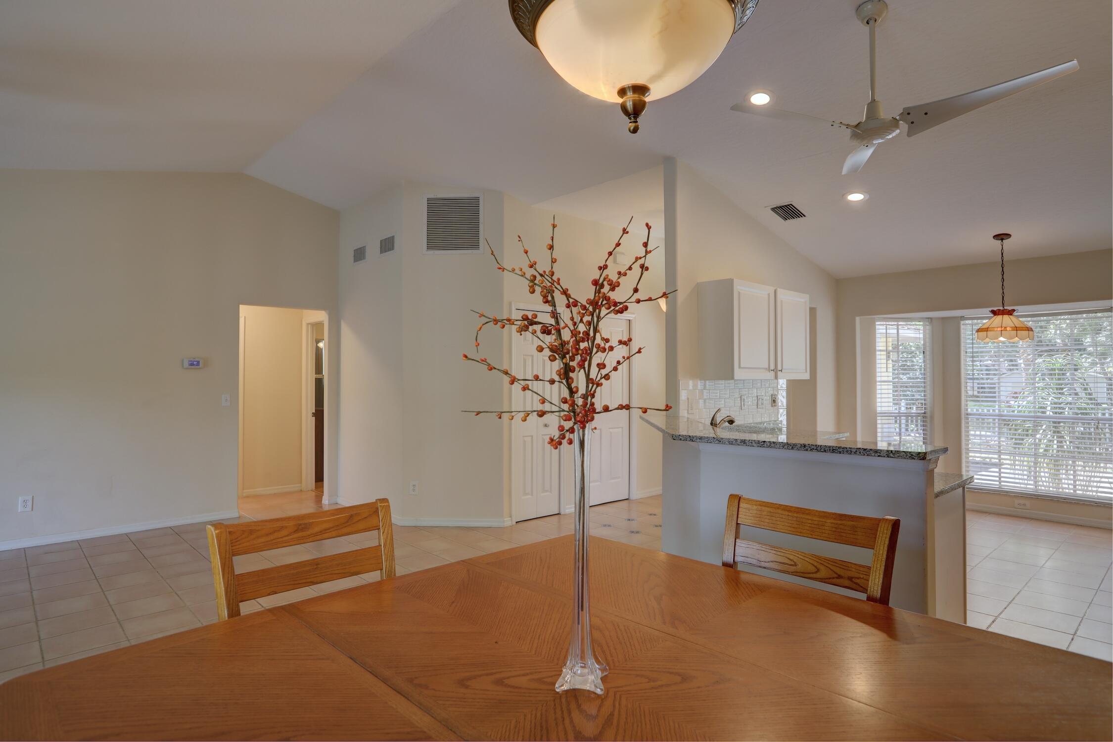 1245 George Street Sebastian, FL 32958 - Photo 21 of 36 a living room with furniture and a chandelier