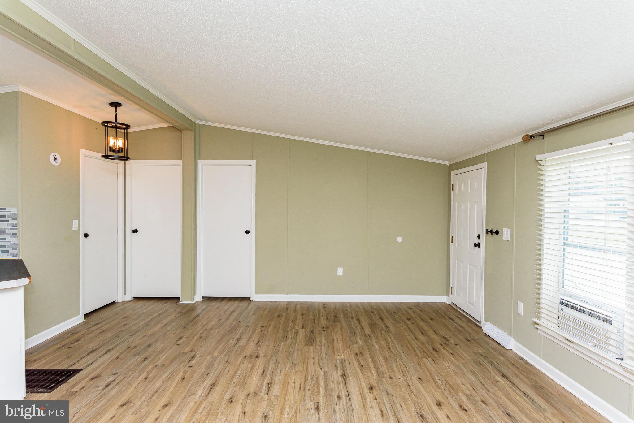 10323 Henry Road, Unit 12 Berlin, MD 21811 - Photo 17 of 52 Living Room flows