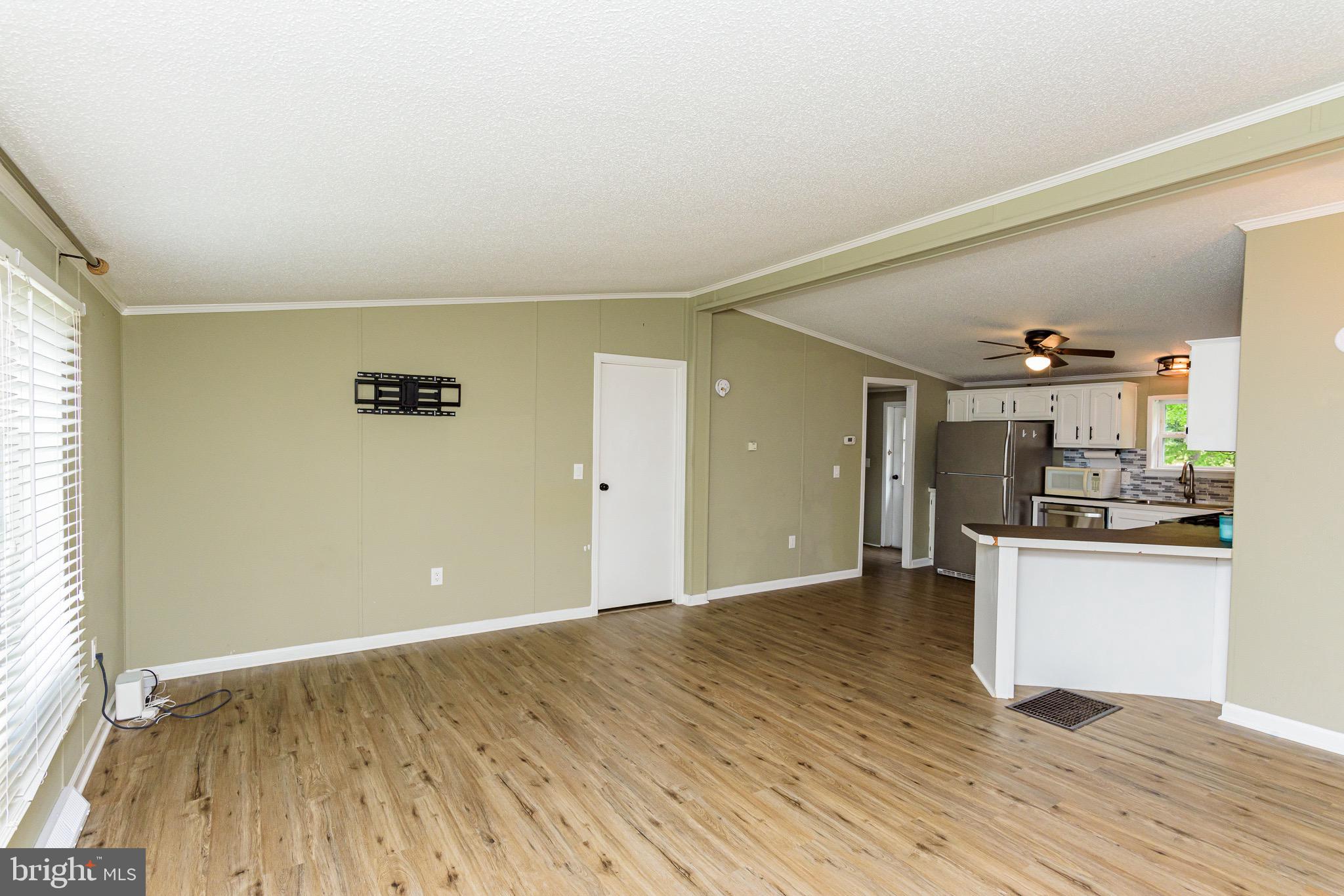 10323 Henry Road, Unit 12 Berlin, MD 21811 - Photo 18 of 52 So m uch space from the living room to the kitchen