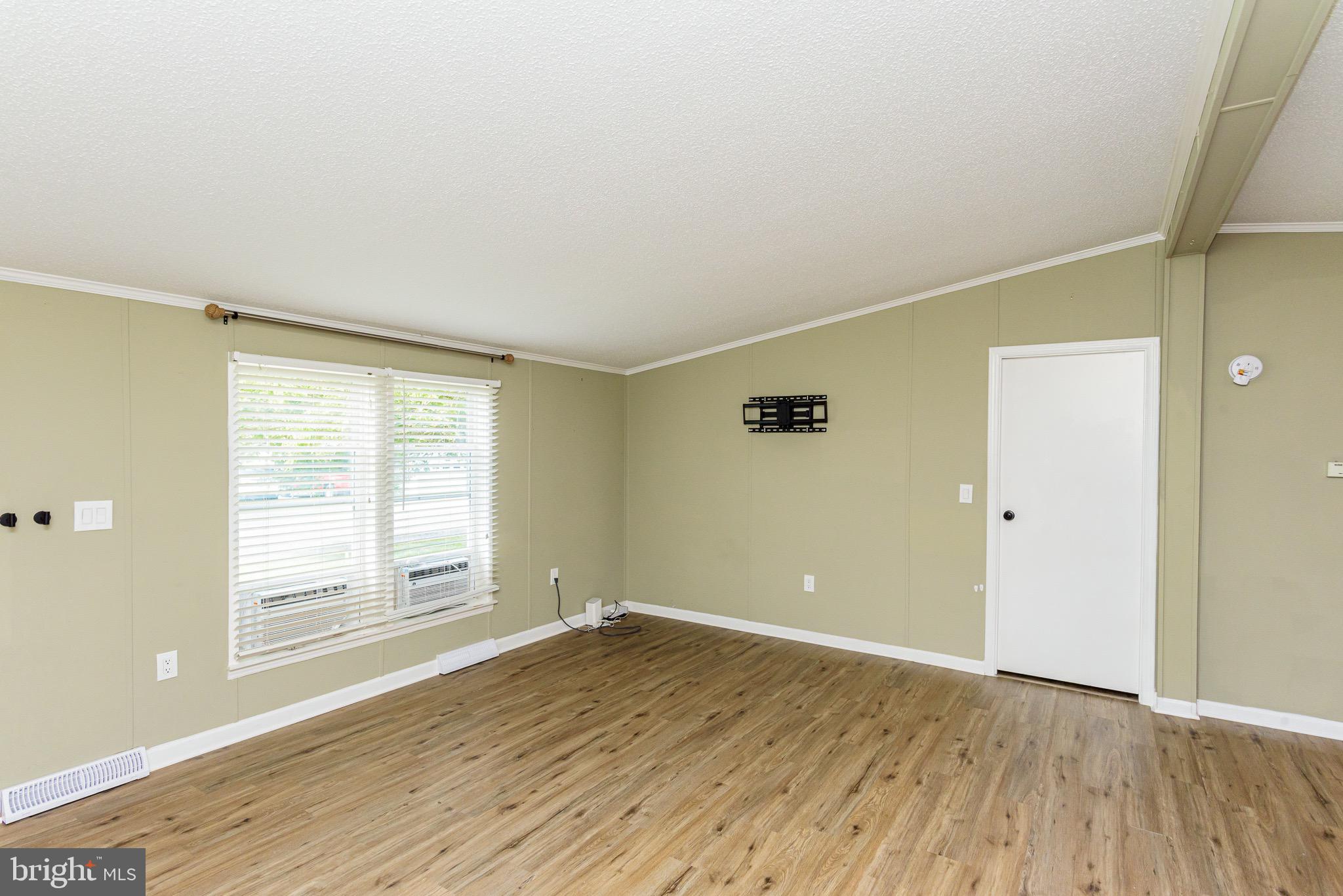 10323 Henry Road, Unit 12 Berlin, MD 21811 - Photo 19 of 52 Great light into the living room