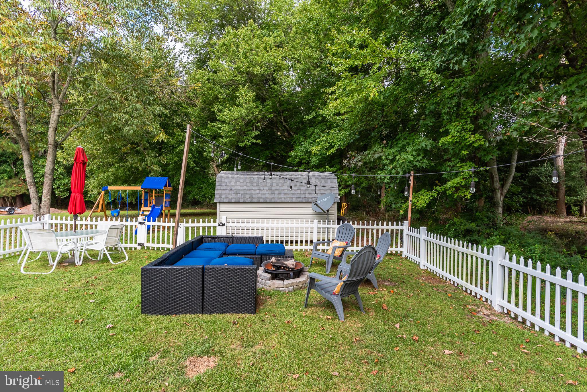 10323 Henry Road, Unit 12 Berlin, MD 21811 - Photo 47 of 52 around the fire pit