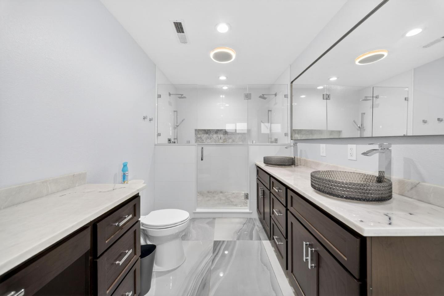 919 Old Canyon Road Fremont, CA 94536 - Photo 19 of 55 a bathroom with a sink a toilet a mirror and shower
