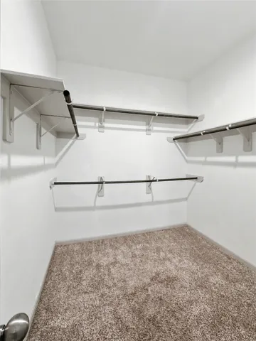 a view of a room with racks on the wall