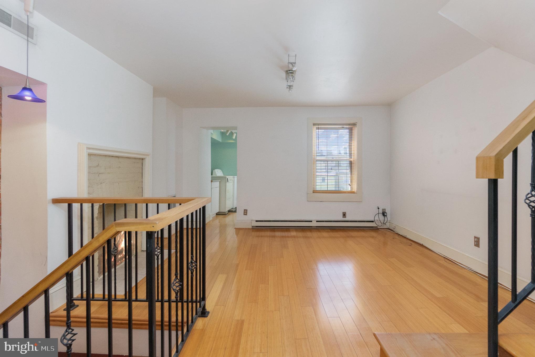 1118 Riverside Avenue Baltimore, MD 21230 - Photo 15 of 28 a view of a room with wooden floor and windows