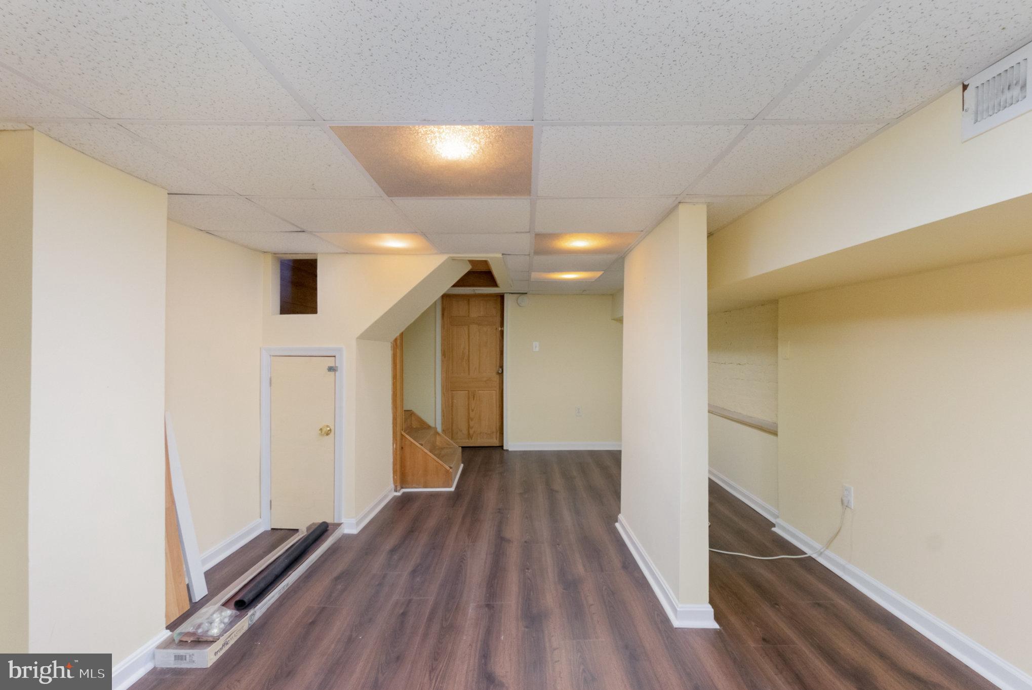 1118 Riverside Avenue Baltimore, MD 21230 - Photo 17 of 28 a view of hallway with wooden floor
