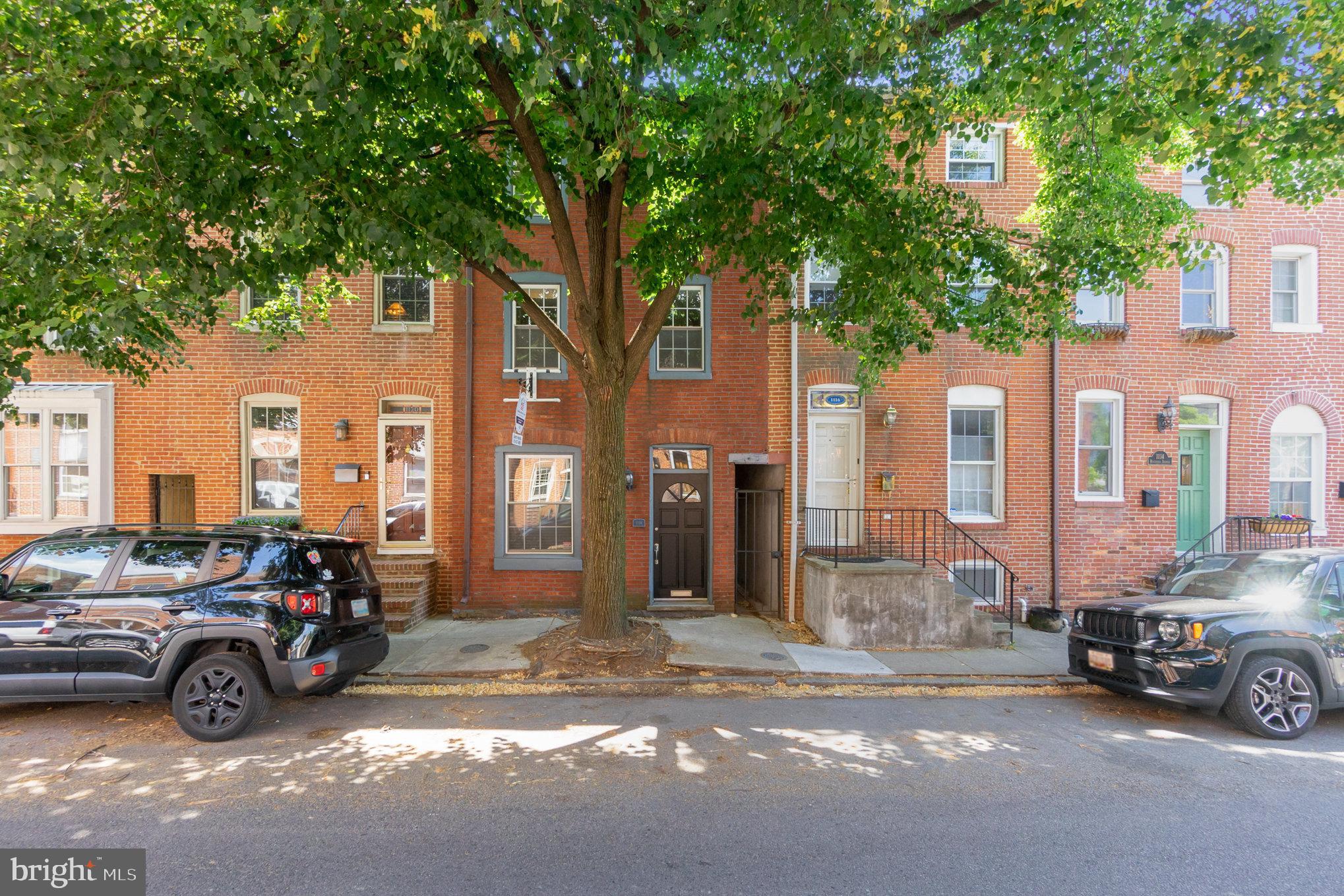 1118 Riverside Avenue Baltimore, MD 21230 - Photo 2 of 28 a view of a cars in front of a house