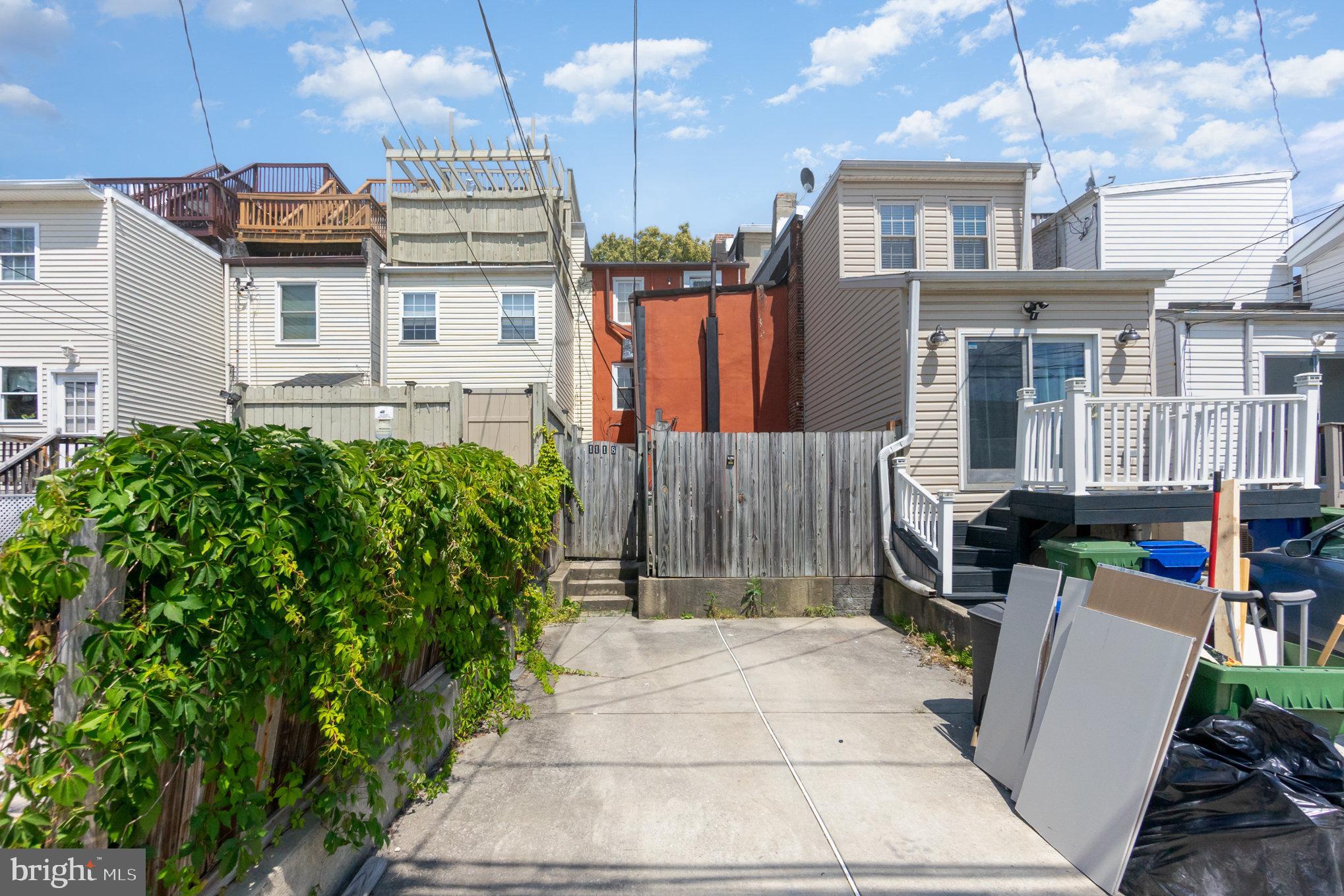 1118 Riverside Avenue Baltimore, MD 21230 - Photo 28 of 28 a front view of a house with a garden