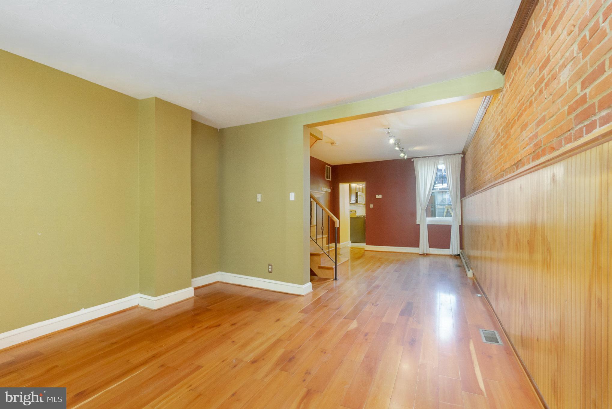 1118 Riverside Avenue Baltimore, MD 21230 - Photo 6 of 28 a view of hallway with wooden floor
