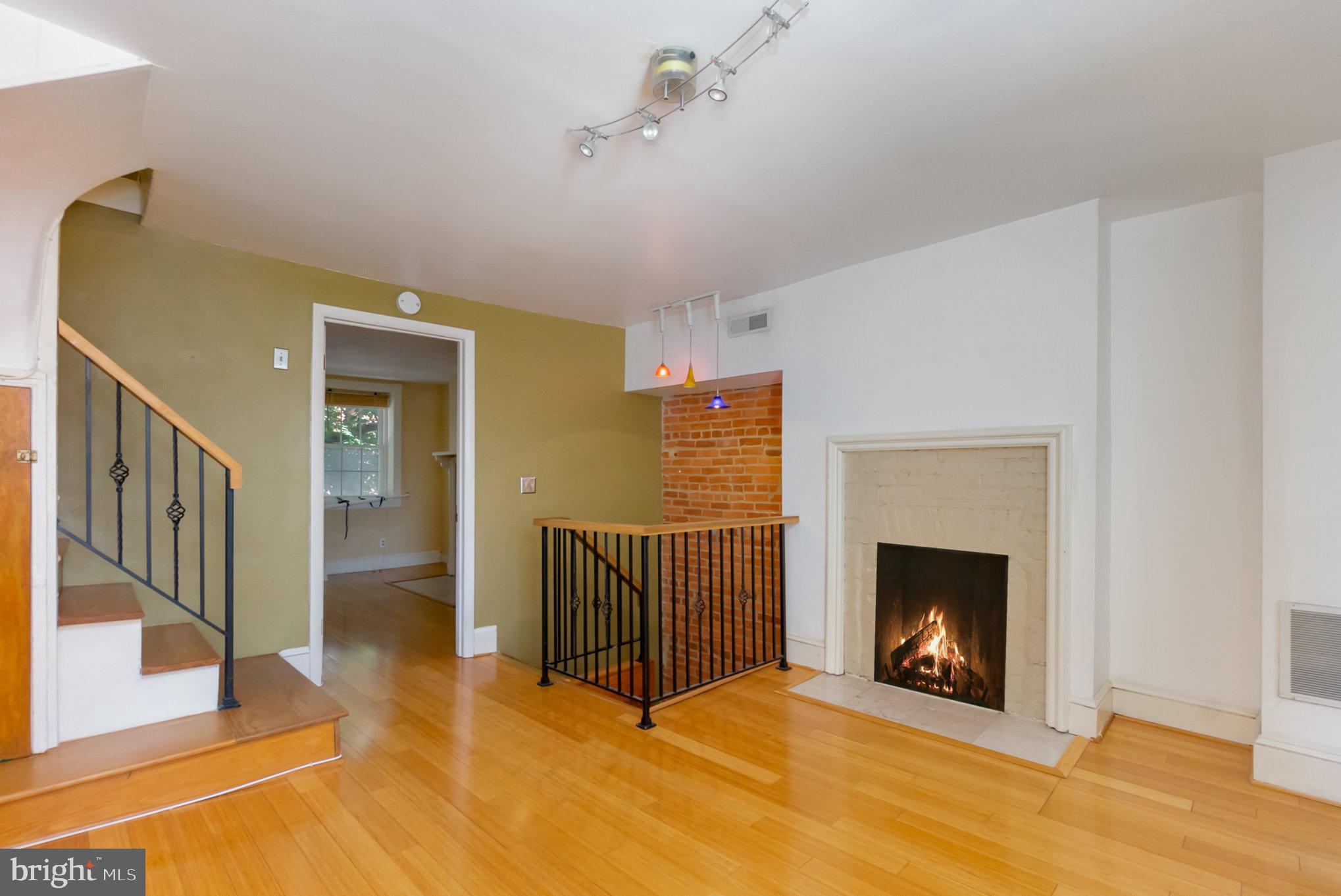 1118 Riverside Avenue Baltimore, MD 21230 - Photo 8 of 28 a view of an empty room with a fireplace