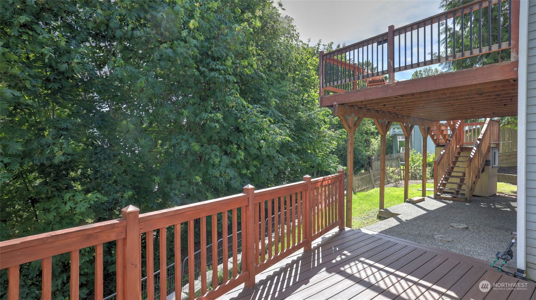 16844 119th Place Northeast Bothell, WA 98011 - Photo 20 of 26 a view of a wooden deck with a yard