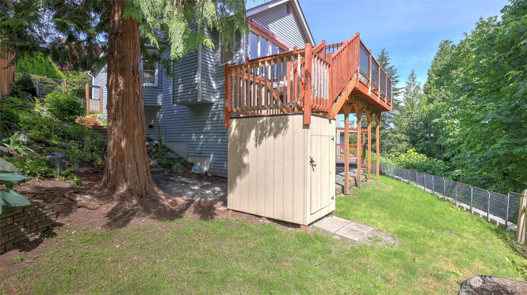 16844 119th Place Northeast Bothell, WA 98011 - Photo 21 of 26 a backyard of a house with table and chairs