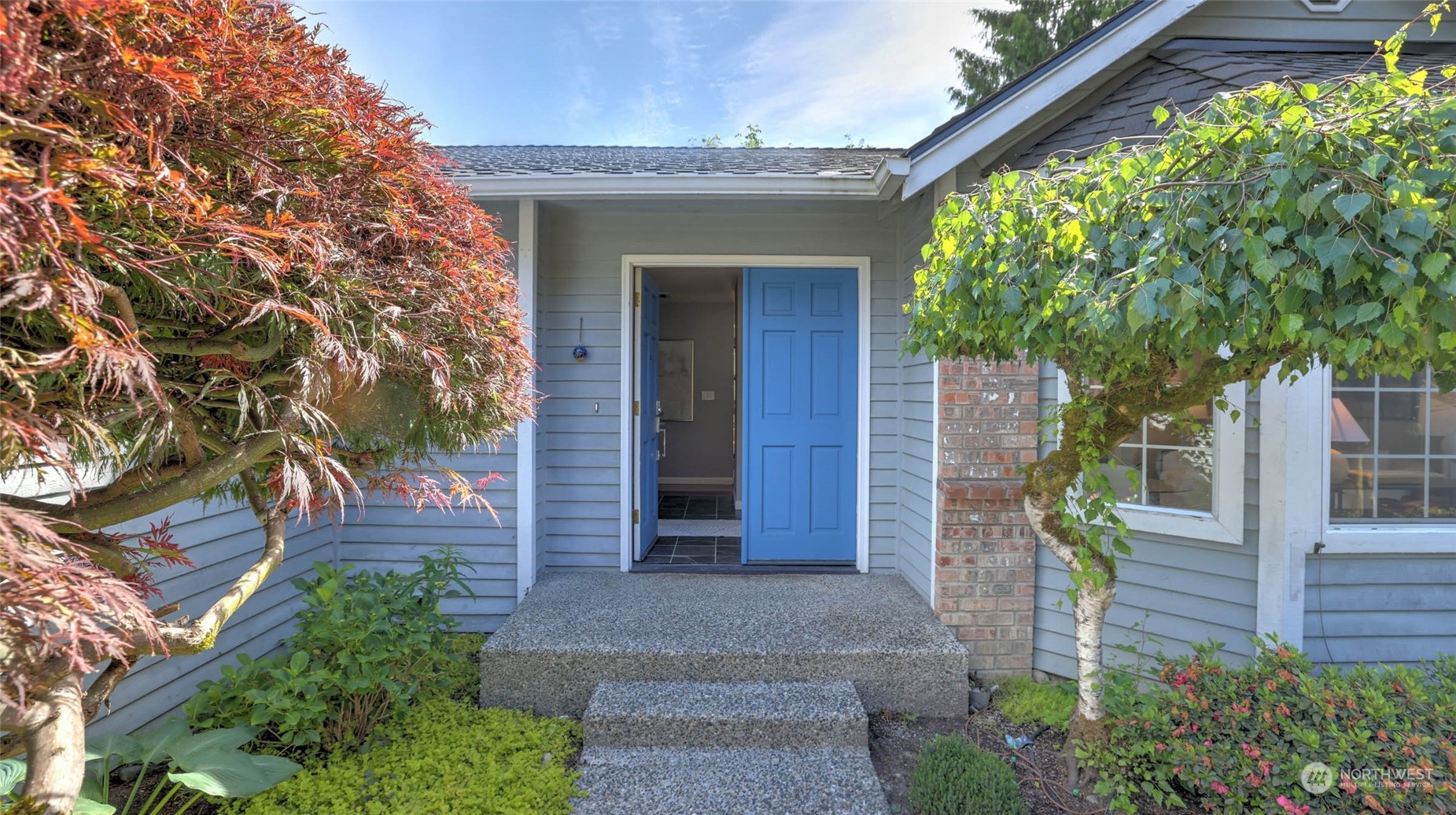 16844 119th Place Northeast Bothell, WA 98011 - Photo 22 of 26 a front view of a house with a tree